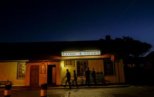 Just after sunset, patrons gather for food, fun, dancing and drinks at the Globe Tavern in Stanley, Falkland Islands. (Jahi Chikwendiu/The Washington Post) 