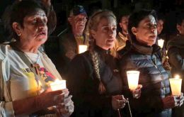 Lilian Tintori holds candlelight vigil outside the prison building where her husband is under arrest.