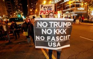 In downtown Chicago, 1,800 people gathered outside the Trump International Hotel and Tower, chanting phrases like “No Trump! No KKK! No racist USA.”  
