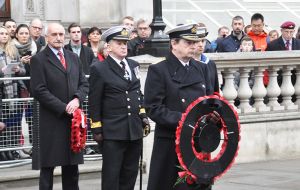Second Sea Lord, Vice Admiral Jonathan Woodcock goes forward to lay his wreath.