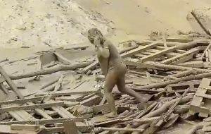 Evangelina Chamorro emerged near a bridge, lifting herself from a current of wooden planks and walking toward the shore covered head to toe in mud.
