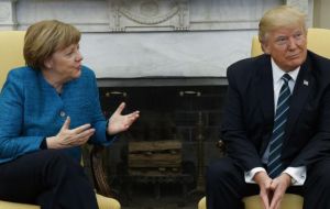 In the video, Merkel can be seen saying: “do you want to have a handshake?” Trump turns and looks at her but continues sitting in the same position. 