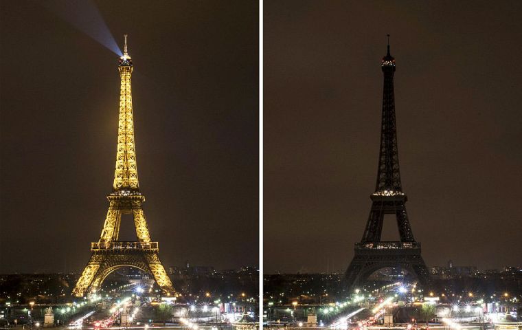 In Paris, the lights of the Eiffel Tower went out from midnight (23:00 GMT) in a tribute to the victims.