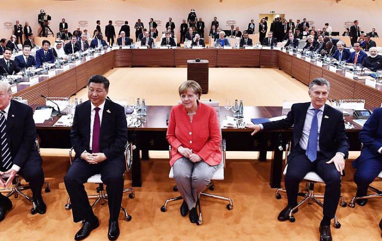 “In the end, the negotiations on climate reflect dissent – all against the United States of America,” Merkel told reporters at the end of the meeting