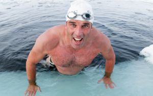 British endurance swimmer Lewis Pugh completed a 1km swim in the freezing waters of UK Overseas Territory South Georgia and the South Sandwich Islands