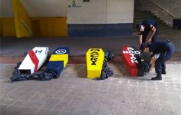 The four “coffins” discovered by the police in Rosario, with the yellow one dedicated to president Macri