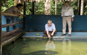 Peru's foreign minister Nestor Popolizio accompanied Johnson to an animal rescue centre to see animals rescued as part of crackdown on the illegal wildlife trade. 