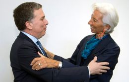 The photo all Argentina was expecting: IMF Managing director Christine Lagarde greets Argentina's Finance minister Nicolas Duvjovne before talks started 