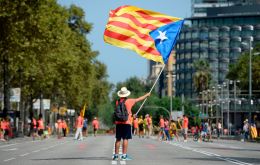 A sea of protesters wearing red shirts and bearing red-and-yellow Catalan flags banged drums, blew whistles and chanted slogans of support