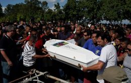 Wearing white T-shirts with Candido’s photo, relatives, friends and fans sang the team’s anthem and chanted “Flamengo, Flamengo” as they accompanied the coffin