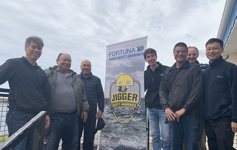 Jigger crew members with Fortuna Ltd. representatives 
