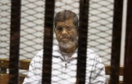 The imprisoned former elected Egyptian president Mohammed Morsi died in a Cairo hospital after fainting during a court session.