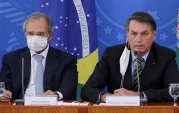 Speaking next to president Bolsonaro, Guedes  (L) said that Brazil does not want to become an Argentina or a Venezuela.