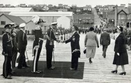 Prince Philip being welcomed on the Public Jetty on his arrival at Stanley 1957. (Courtesy of British Antarctic Survey Archives)