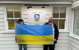 MLAs Gavin Short and Roger Spink at Gilbert House with Ukrainian flag