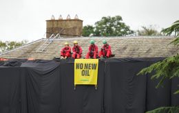 Four individuals scaled Sunak's large house in North Yorkshire and dropped long black sheets to cover the facade and holding up a banner that read “No New Oil.”