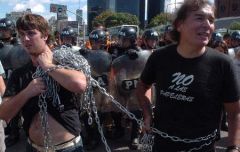 The environmentalist demonstrators chained themselves to the ferry company fences