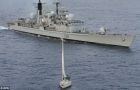 HMS Gloucester looms over the yacht Tortuga whilst a Cape Verde law enforcement team searches for narcotics on board<br />
<br />