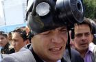 Correa abandons the scene after being shouted down and gassed
