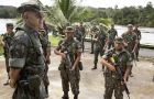 A few of the 9.000 heavily armed soldiers listening to instructions