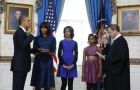 Obama taking the presidential oath at the Blue Room with his family