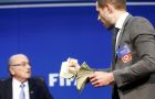 This is for North Korea 2026, Brodkin said as he put the bills on the desk in front of Blatter. He then tossed the notes into the air as security led him away. (Pic Reuters)
