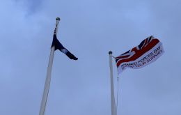 The Armed Forces Day flag flying at Victory Green in windy Stanley on 29th June.