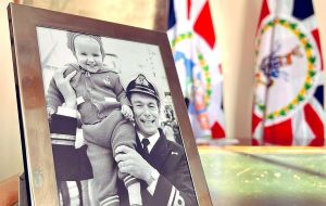 “During my brief tenure as Acting Governor, it’s home to a photo of me with my Dad in 1982 on his return to UK after the conflict”