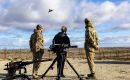 Watching a Typhoon fighter next to infantry defenses (Pic BFSAI)