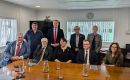 Minister Pollard MP and Governor Alison Blake with seven of the eight members of the Legislative Assembly