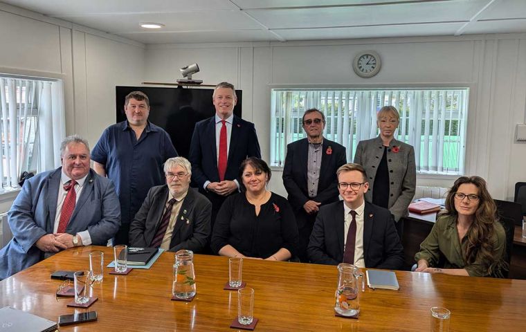 Minister Pollard MP and Governor Alison Blake with seven of the eight members of the Legislative Assembly