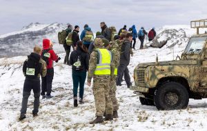 FIDF personnel help guide competitors to the snow covered peaks