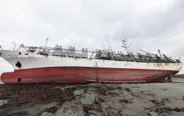 Korean flagged jigger 107 Eun Hae remains grounded on a sandbank off Settlement Cove, Saunders Island