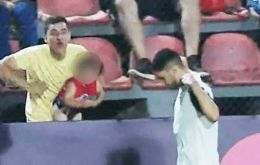 A Paraguayan fan holding a child was caught on camera imitating a monkey as Figueredo  left the pitch to be substituted