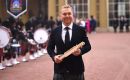 As the first Baton-bearer, Sir Chris Hoy walked through the Quadrangle of Buckingham Palace to the Centre Arch with a pathway lined by Pipers from the Shree Muktajeevan Swamibapa Pipe Band.