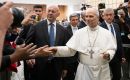 Pope Leo XIV walks down to greet journalists at a meeting in the Paul VI audience hall ten days ago 2025.