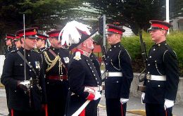 Governor Alan Huckle inspecting FIFD Guard of Honour