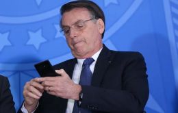 Bolsonaro displayed his electronic anklet while visiting the Lower House 