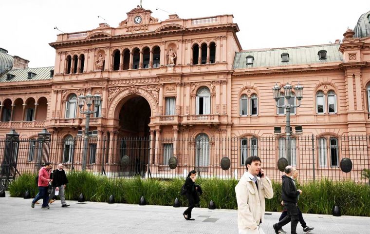 Argentina's economy calmed down on Tuesday after a hectic Monday following the Buenos Aires elections