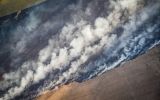 A wildfire during 2023's drought is fought by a crop duster plane in Rocha eastern Uruguay. Photo: Sebastian Astorga Rostani