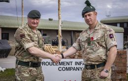 The Rifles (2 RIFLES) left, greets the head of B Company, 1st Battalion, Royal Irish Regiment, right. 