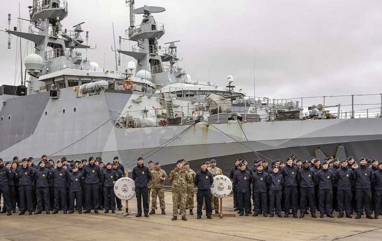 The crews of HMS Medway and Forth pose with their ships (Picture: Royal Navy)