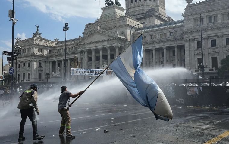Clashes left at least 15 injured and about 30 detained. Authorities said four police officers were hurt after protesters threw stones and Molotov cocktails, and police used tear gas and water cannons