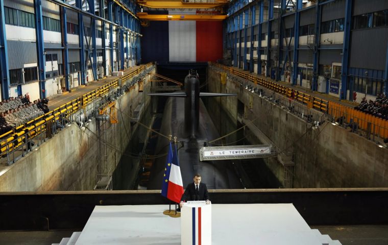 Macron spoke at the Île Longue naval base near Brest, addressing naval officers with a nuclear submarine in the background