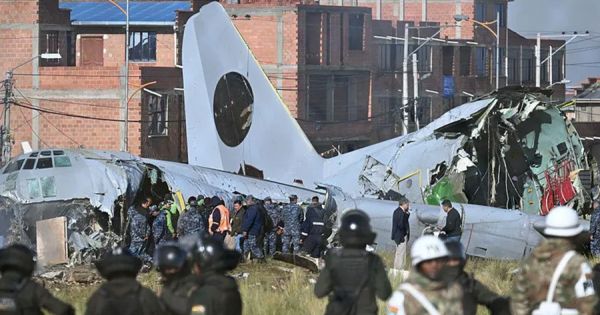 Bolivia jails 19 after people scooped up cash from crashed military plane