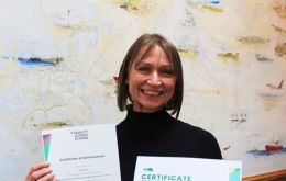 Clare proudly showing her diplomas 