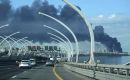A column of black smoke rose over the port, in view of forum attendees, while Pulkovo airport suspended or diverted about thirty flights.