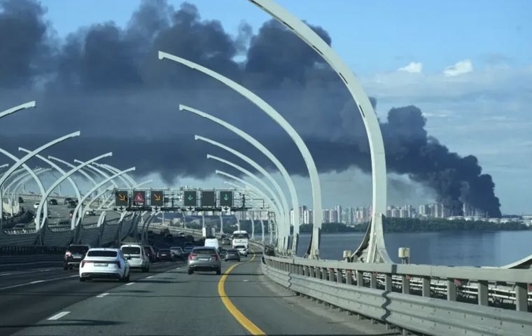 A column of black smoke rose over the port, in view of forum attendees, while Pulkovo airport suspended or diverted about thirty flights.