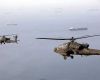 US Apaches fly over the Strait of Hormuz (Picture: Centcom)