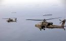 US Apaches fly over the Strait of Hormuz (Picture: Centcom)